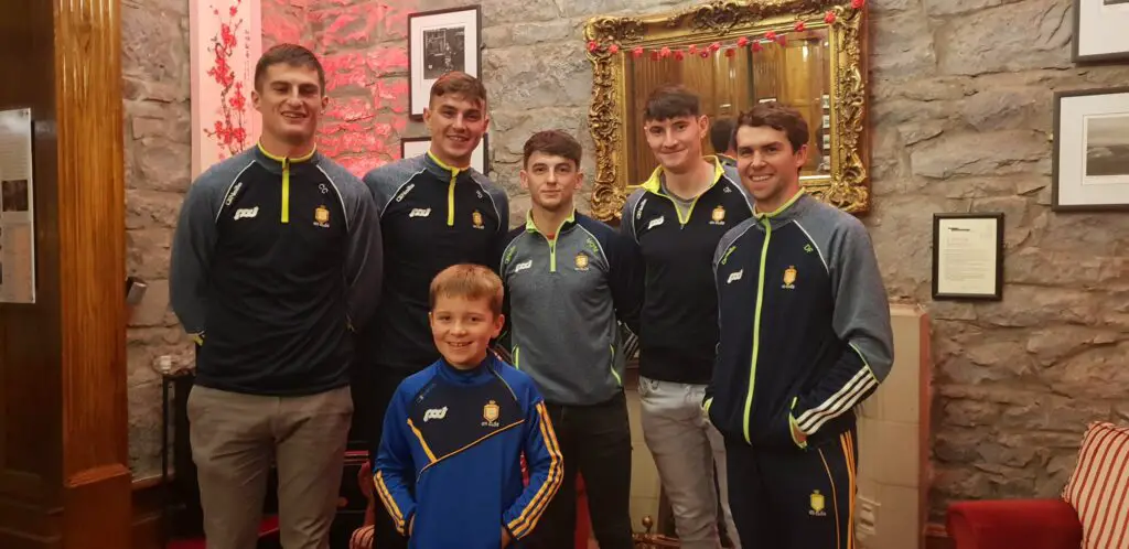 The Clare hurlers with young fan Pierce Shannon from Doolin