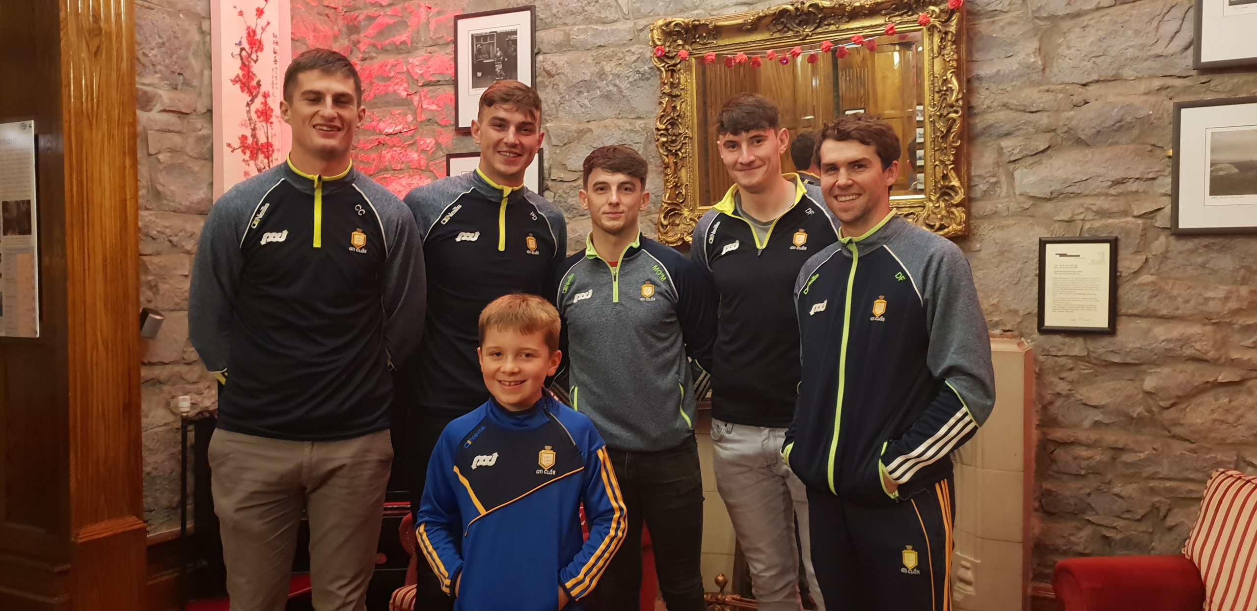 The Clare hurlers with young fan Pierce Shannon from Doolin