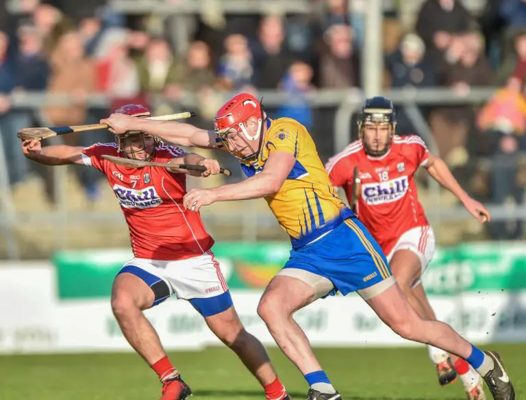 Niall deasy bursts past Richard Cahalane and Eoin Cadogan Photo: Martin Connolly