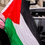 free-photo-of-man-with-palestinian-flag-in-gothenburg-street